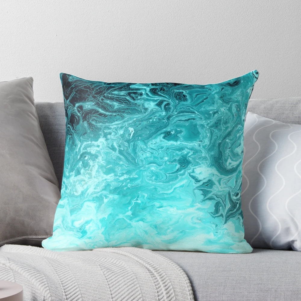 Turquoise pillow with a rippled wave pattern, inspired by the ocean