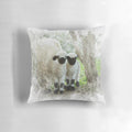 Watercolor painting of two adorable Valais Blacknose lambs on a farmhouse pillow