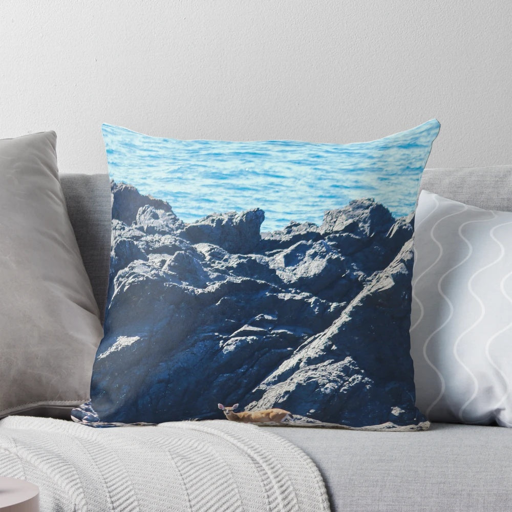 A decorative pillow featuring a scenic image of deer in the coastal environment of Vancouver Island, British Columbia.
