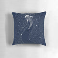 A photo of a pillow with a surreal design featuring a whale shark in a starry, cosmic seascape.