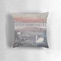 A beautiful throw pillow featuring a serene winter landscape with snow-covered trees and a pair of graceful swans.
