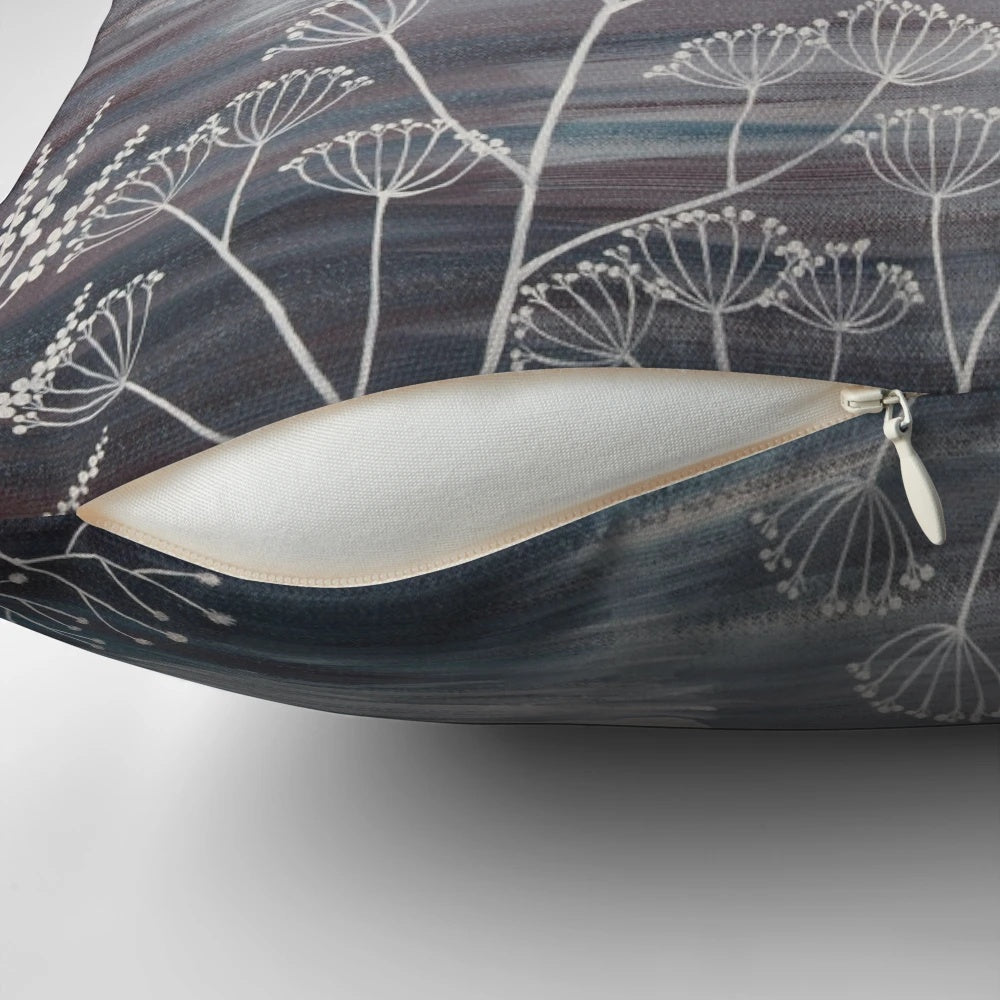 A beautiful throw pillow featuring a serene winter landscape with snow-covered trees and a pair of graceful swans.
