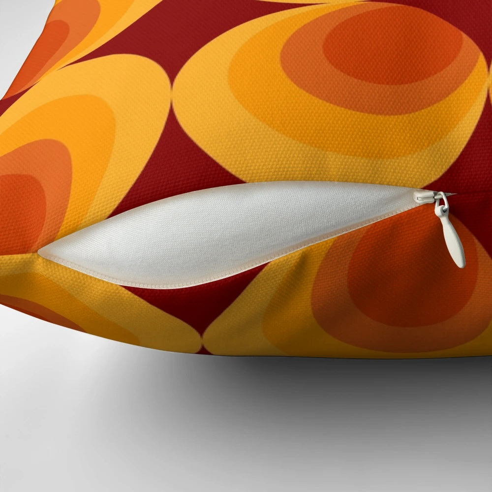 Vibrant burnt orange and white geometric pattern pillow with a retro 1970s-inspired design
