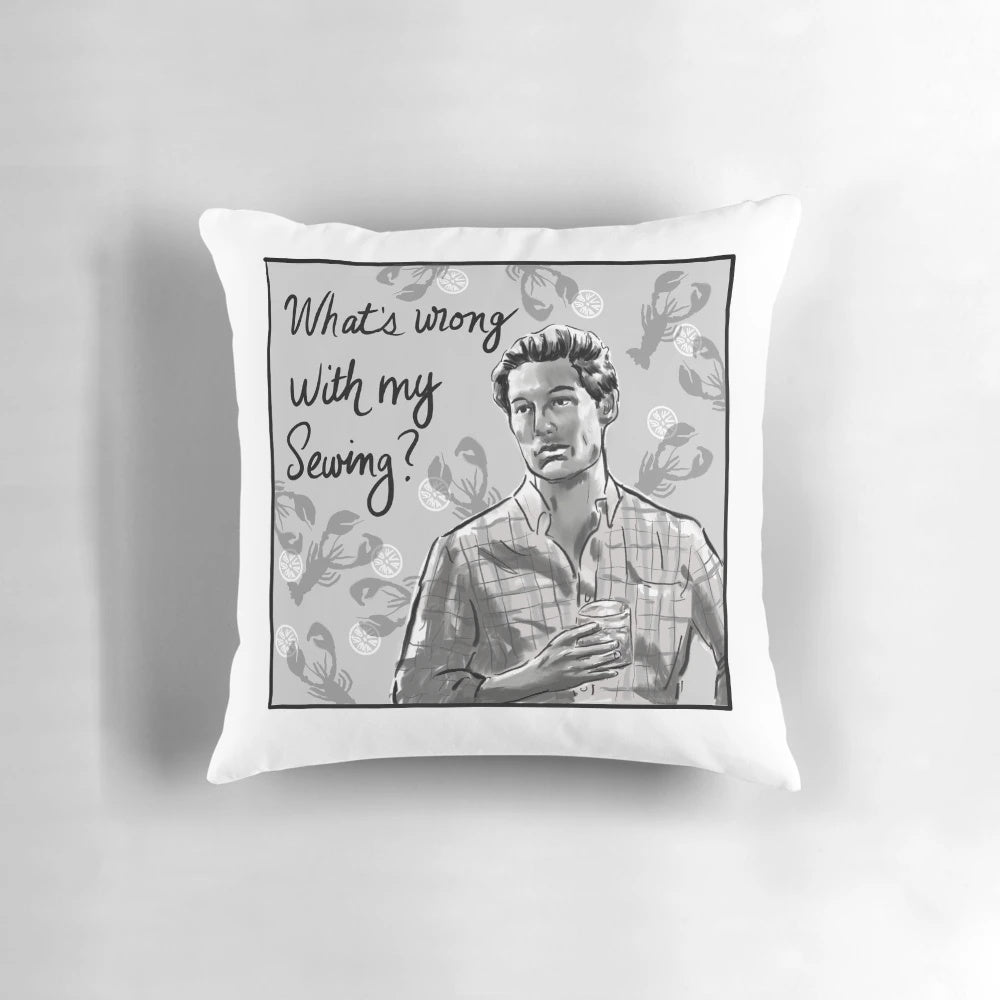 Sewing-themed decorative pillow featuring Craig Conover's "What's Wrong With My Sewing?" quote