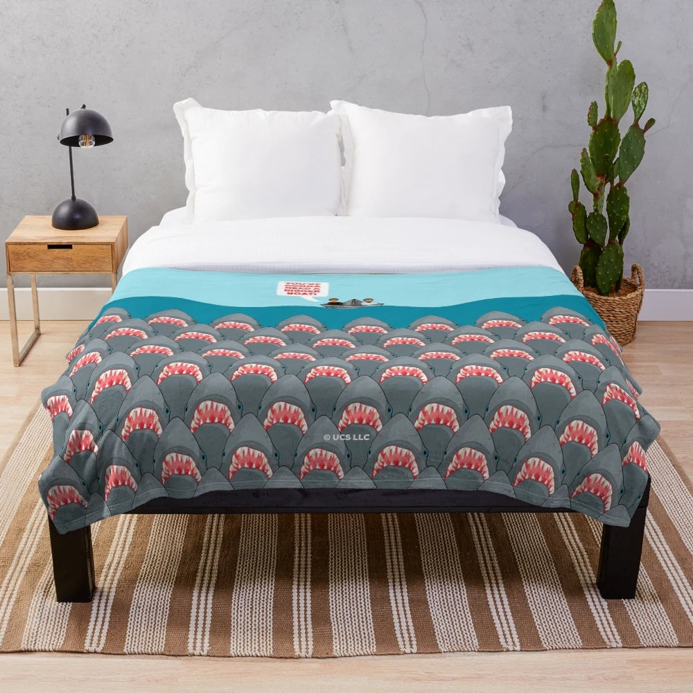 Plush blanket with Jaws movie sharks design for horror movie fans