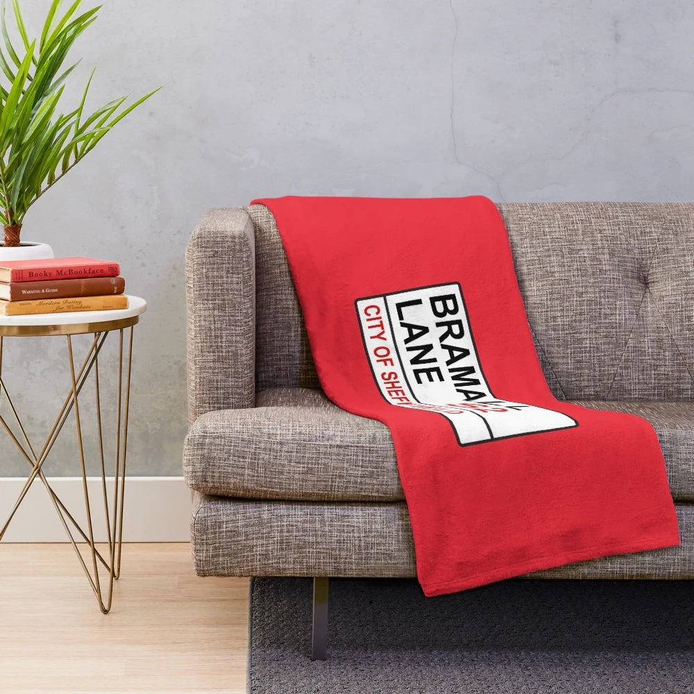 Soft and cozy plush blanket featuring the Sheffield football team and Bramall Lane street sign