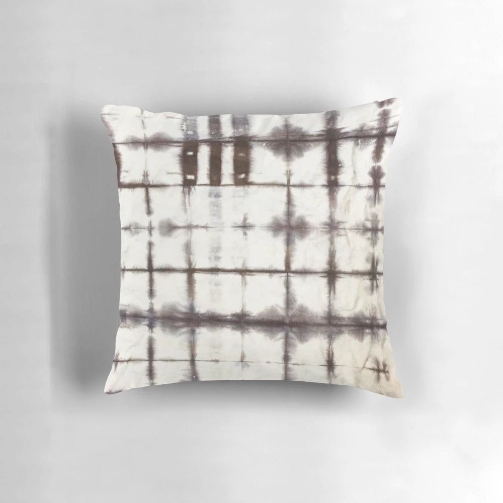 Shibori-dyed decorative pillow with a modern, trendy design