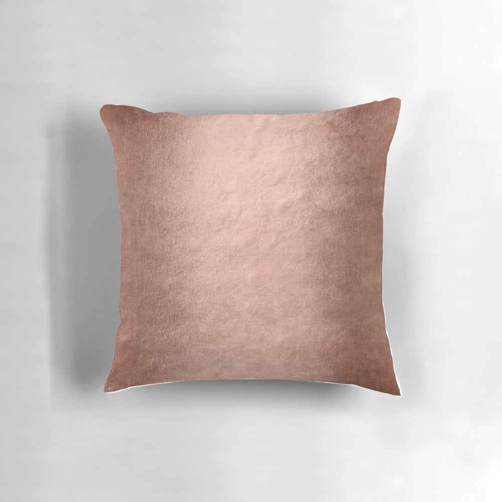Closeup of a shiny, faux metallic copper textured pillow for home decor