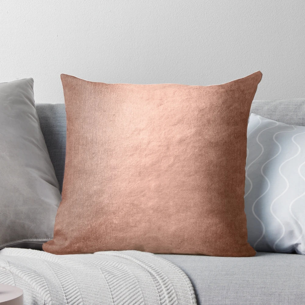 Closeup of a shiny, faux metallic copper textured pillow for home decor