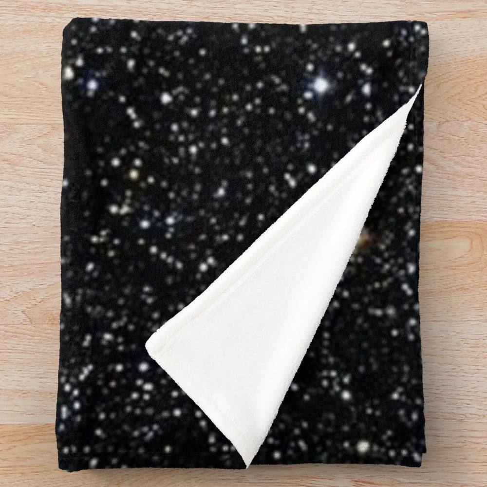 Glittery black plush blanket with starry night design