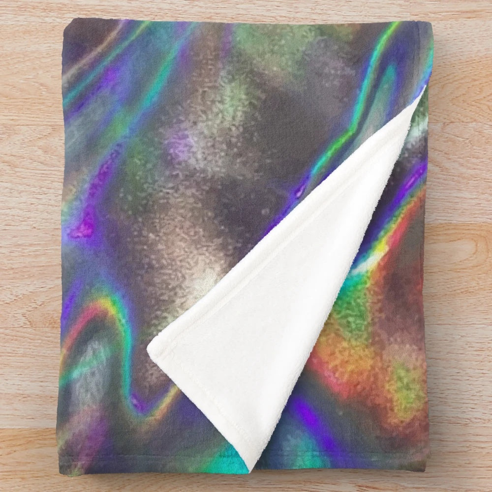 Holographic plush blanket with a mesmerizing, futuristic design