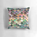 Copper, green, and gold mermaid scales pattern on a plush, sparkly pillow