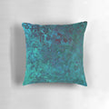 Shimmering ocean-inspired throw pillow with a textured, water-like design