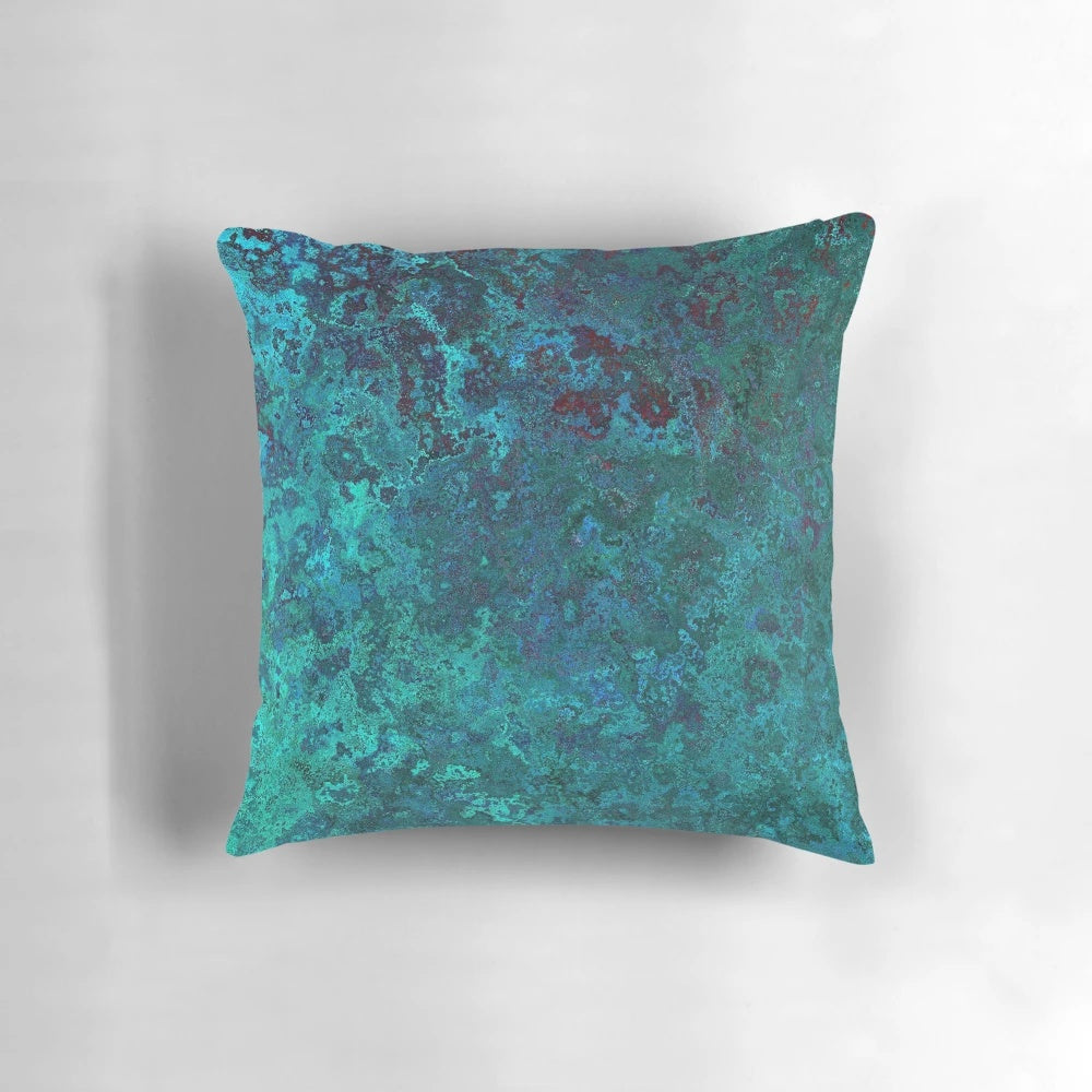 Shimmering ocean-inspired throw pillow with a textured, water-like design