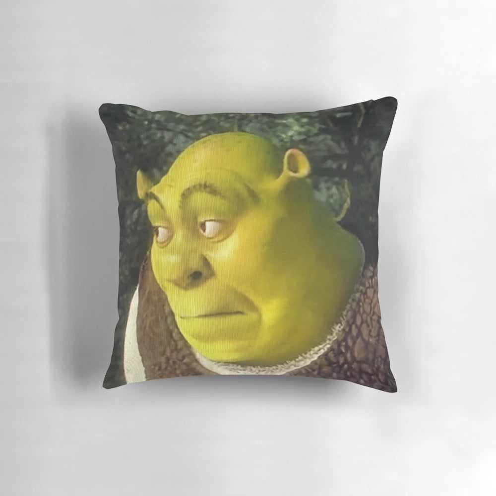 A vibrant, green pillow featuring the iconic Shrek character's face in a meme-inspired design.