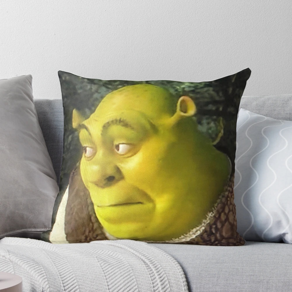 A vibrant, green pillow featuring the iconic Shrek character's face in a meme-inspired design.