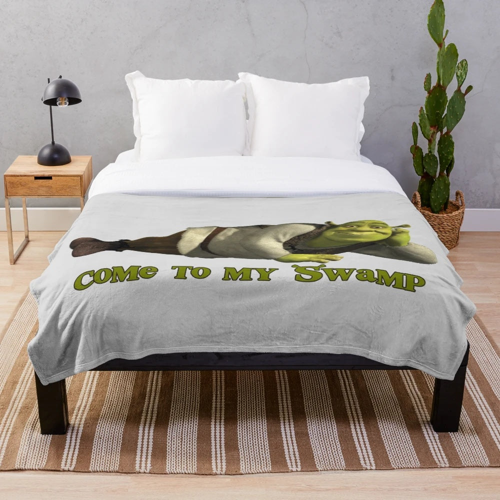 Shrek-themed plush blanket with green ogre design