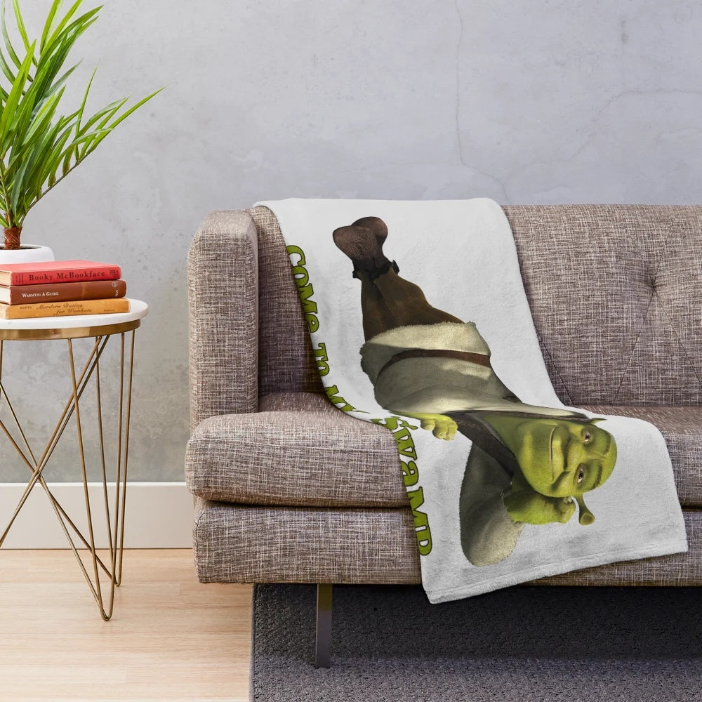 Shrek-themed plush blanket with green ogre design