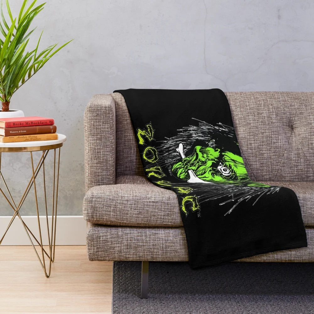 Plush blanket featuring a shrunken head design inspired by the work of Pushead and Zorlac skateboards