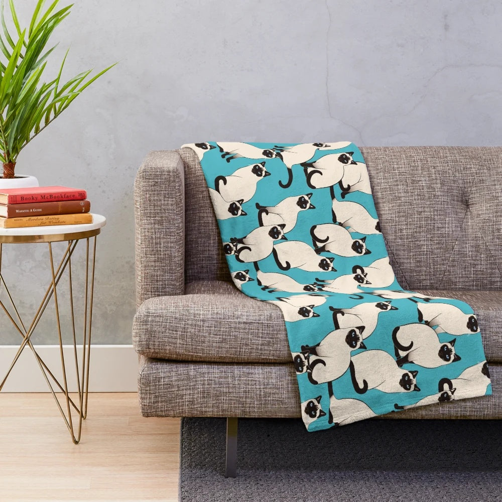 Soft and cozy plush blanket featuring a beautiful pattern of siamese cats