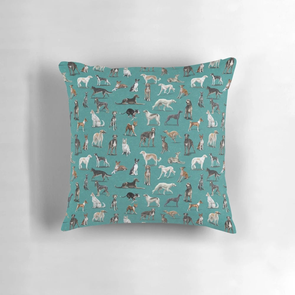 A green decorative pillow featuring various sighthound dog breeds such as greyhounds, whippets, and Italian greyhounds.