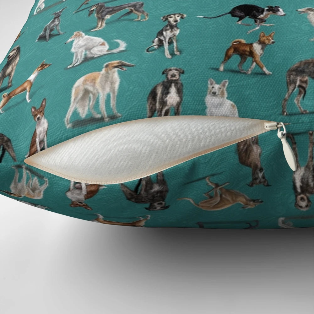 A green decorative pillow featuring various sighthound dog breeds such as greyhounds, whippets, and Italian greyhounds.