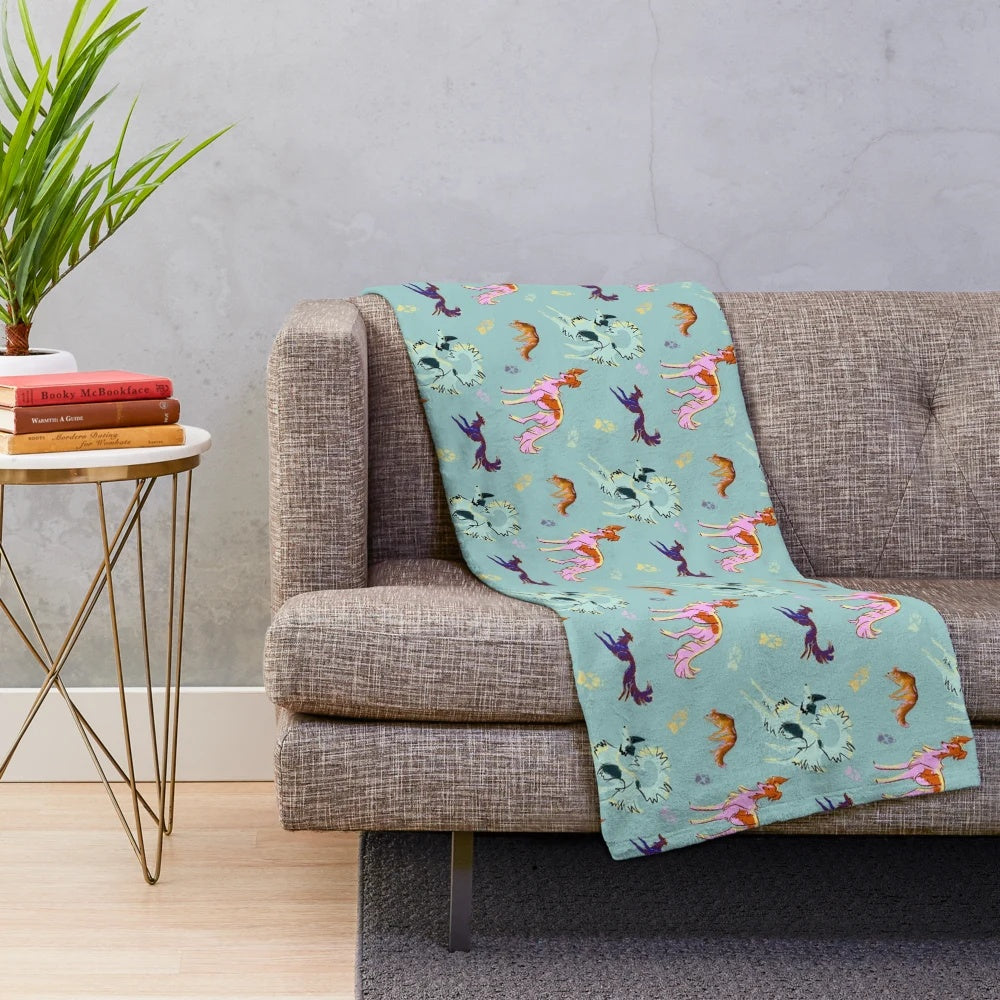 Plush blue blanket with silky, decorative windhound pattern