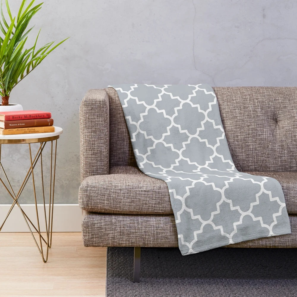 Silver grey and white quatrefoil patterned plush blanket