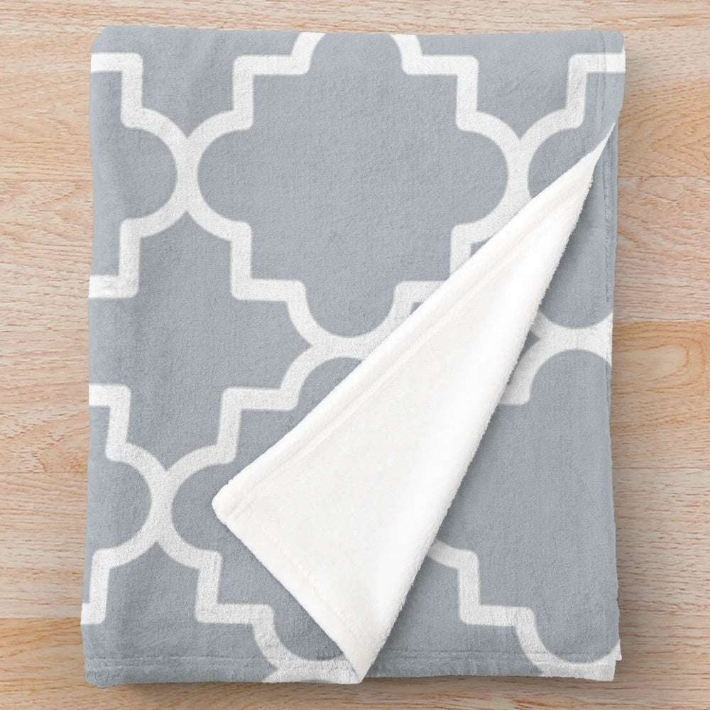 Silver grey and white quatrefoil patterned plush blanket