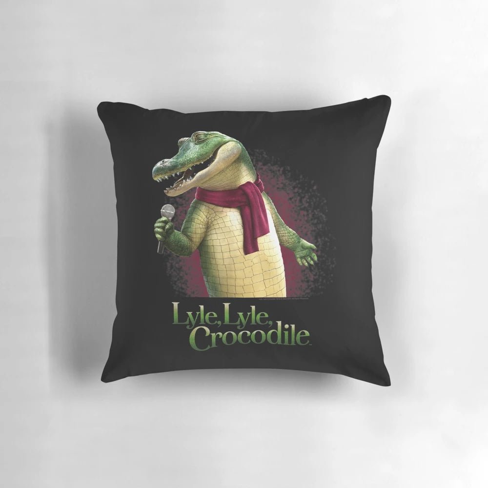 A plush pillow depicting Lyle the singing crocodile from the movie Lyle Lyle Crocodile