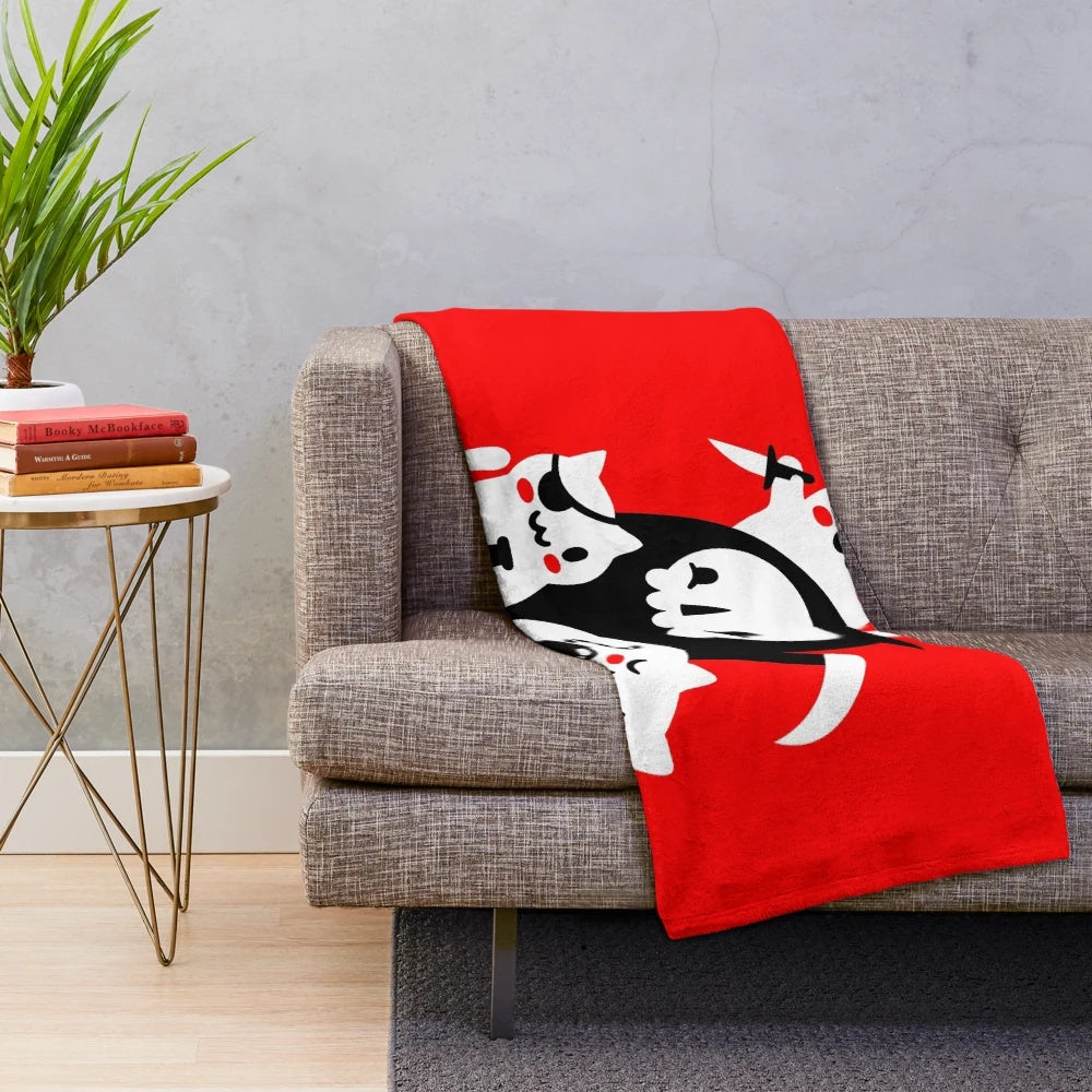 Plush blanket featuring kittens and skulls in a dark, gothic design