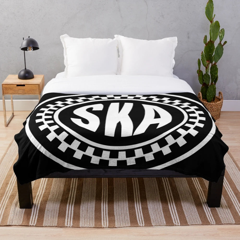 Plush blanket featuring the iconic ska music symbol or logo