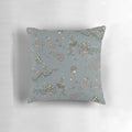 Decorative throw pillow featuring a skeleton design with floral garlands