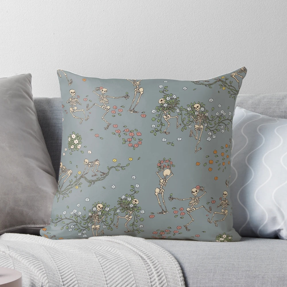 Decorative throw pillow featuring a skeleton design with floral garlands