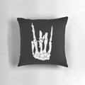 Skeleton hand-shaped throw pillow with a rocker/punk design