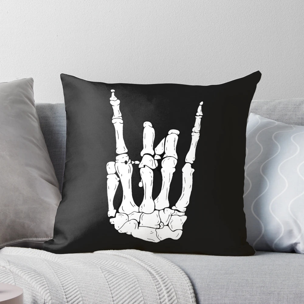 Skeleton hand-shaped throw pillow with a rocker/punk design