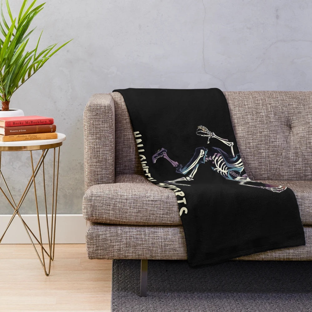 Skeleton playing football on a plush blanket