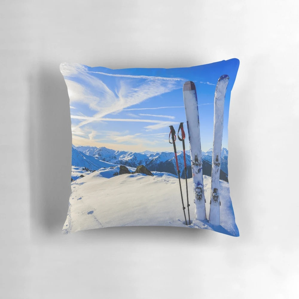 Ski mountain scene printed on a decorative pillow, featuring snowy mountains and skiing imagery.