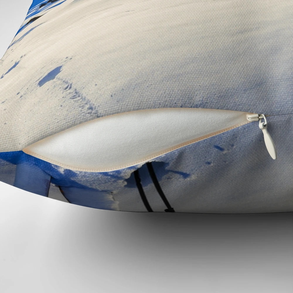 Ski mountain scene printed on a decorative pillow, featuring snowy mountains and skiing imagery.