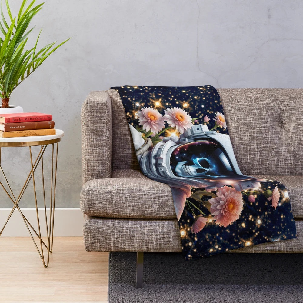 Skull astronaut plush blanket featuring a surreal sci-fi illustration of a skeleton in an astronaut suit on an alien planet