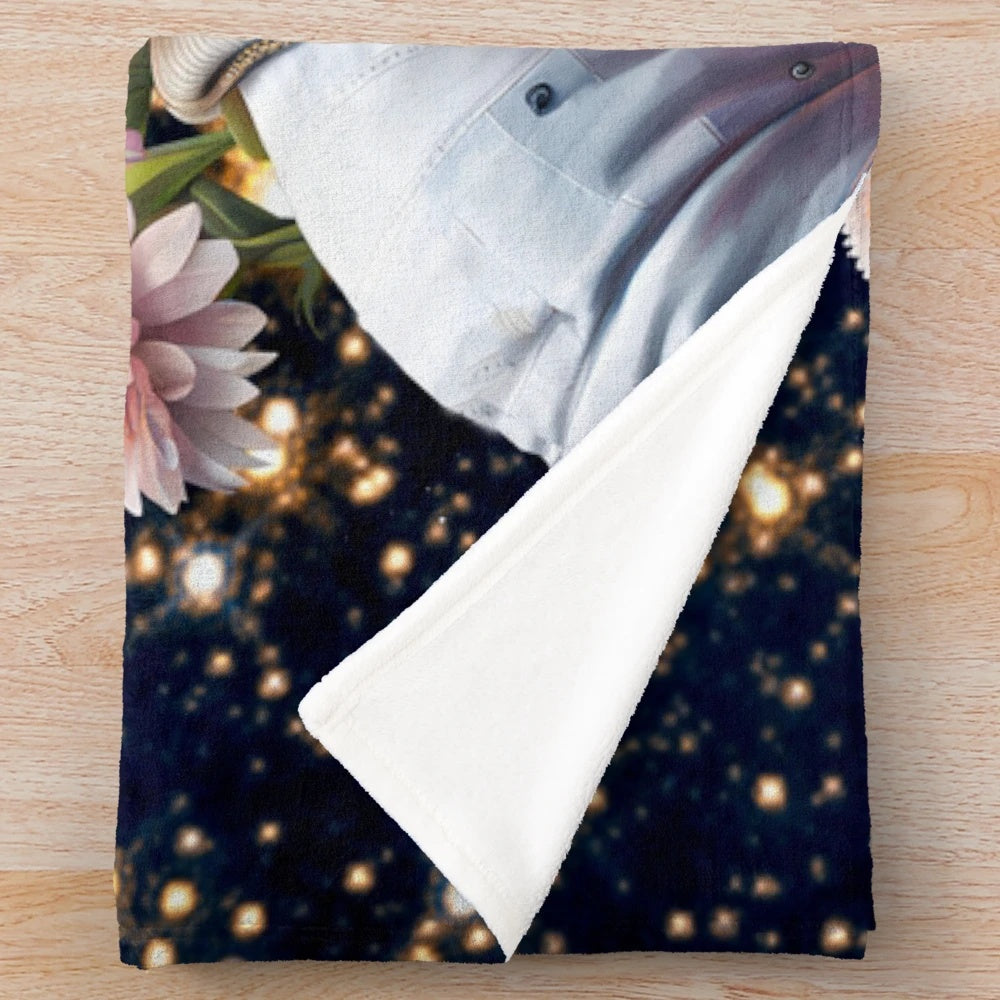 Skull astronaut plush blanket featuring a surreal sci-fi illustration of a skeleton in an astronaut suit on an alien planet
