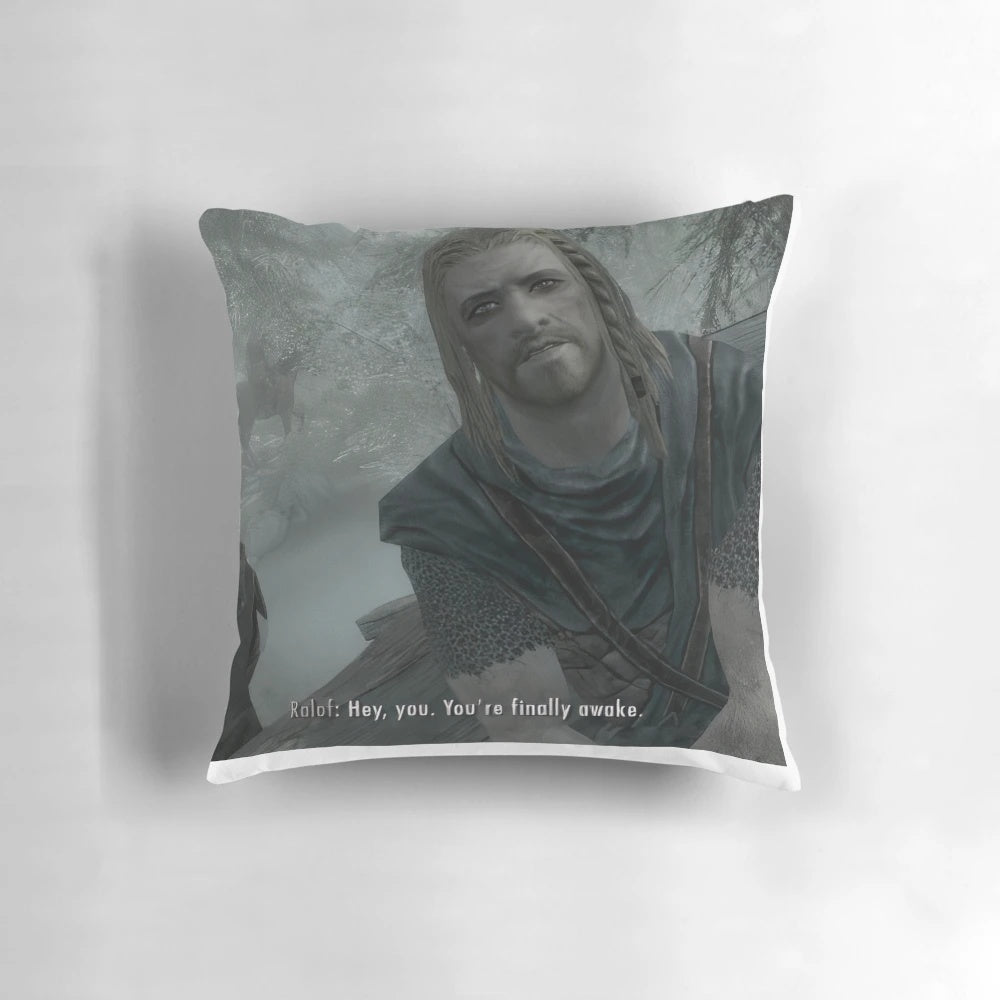 A plush pillow featuring the iconic "Hey, you're finally awake" meme from the Skyrim video game