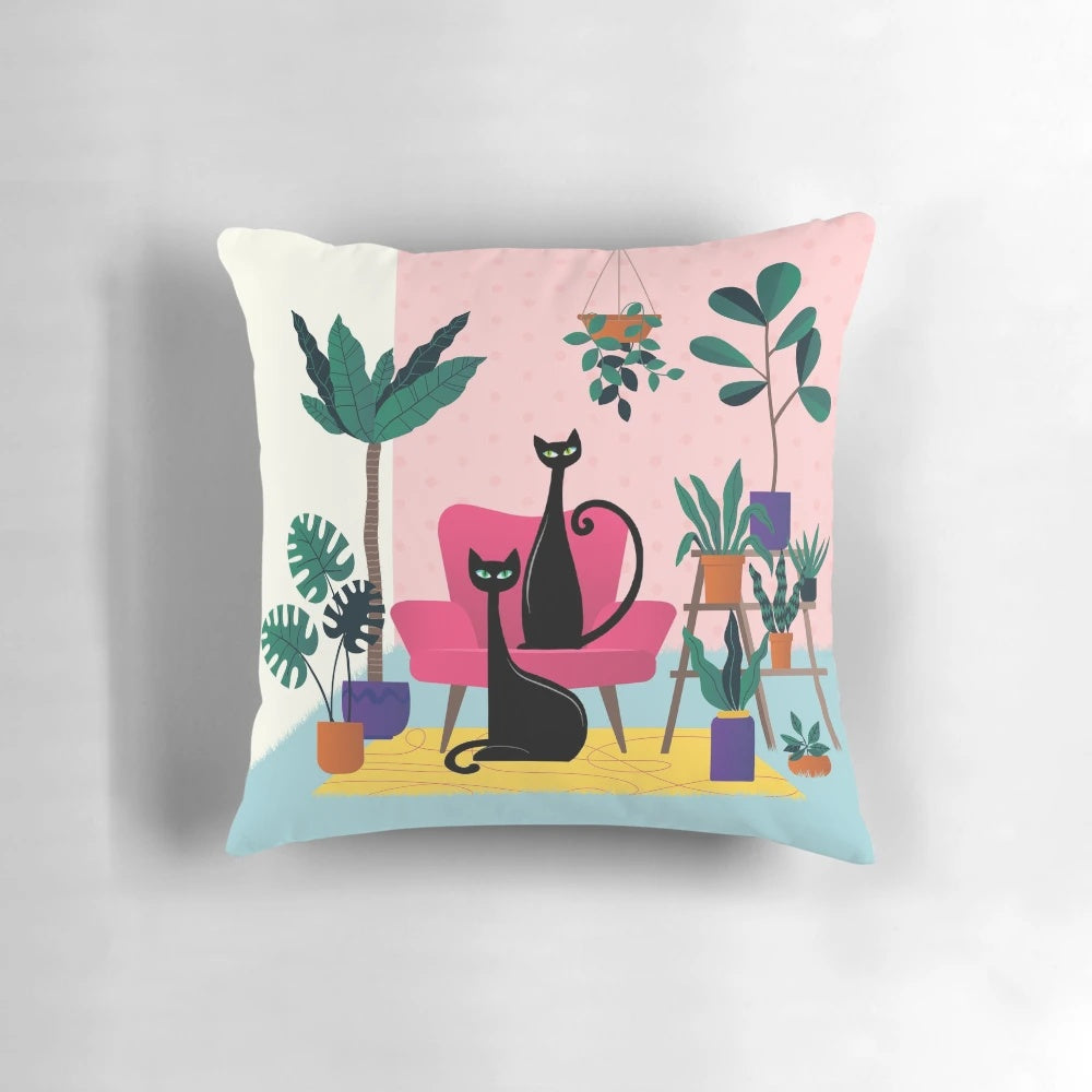 Stylish black cat pillow with lush tropical plants and mid-century modern accents