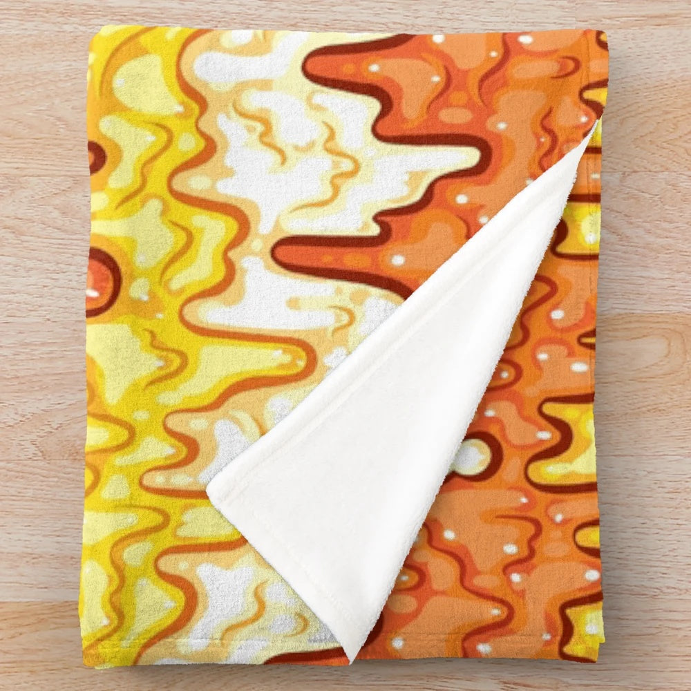Slime-patterned plush blanket featuring a repeating candy corn motif