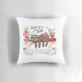 A cozy sloth-themed decorative pillow with a message of self-care and relaxation.