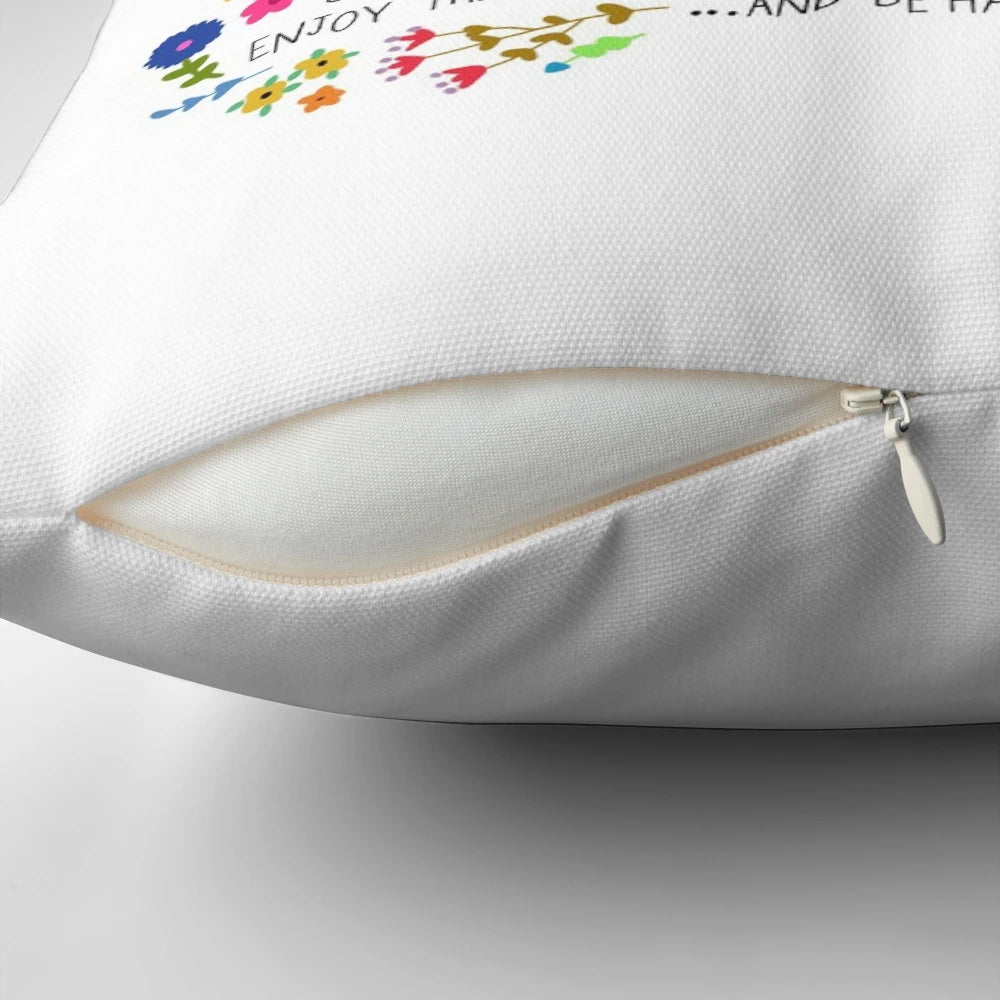 A cozy sloth-themed decorative pillow with a message of self-care and relaxation.