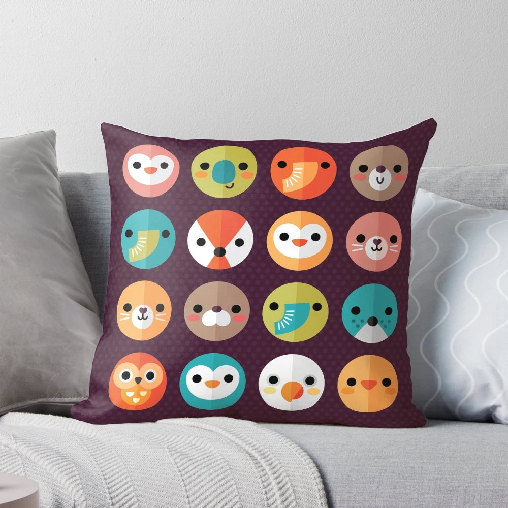 Smiley faces and cute animal faces printed on a soft, plush pillow for a cozy, colorful bedroom or living room.