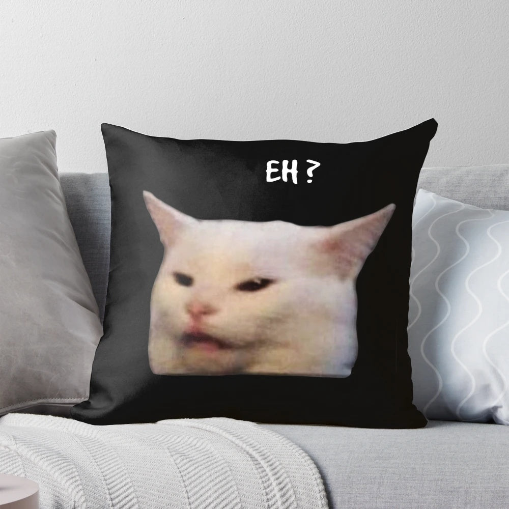 Smudge the cat sitting on a table, a popular and funny cat meme image printed on a soft pillow