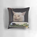 Smudge the cat, a popular meme featuring a confused and angry-looking white cat, printed on a plush throw pillow.