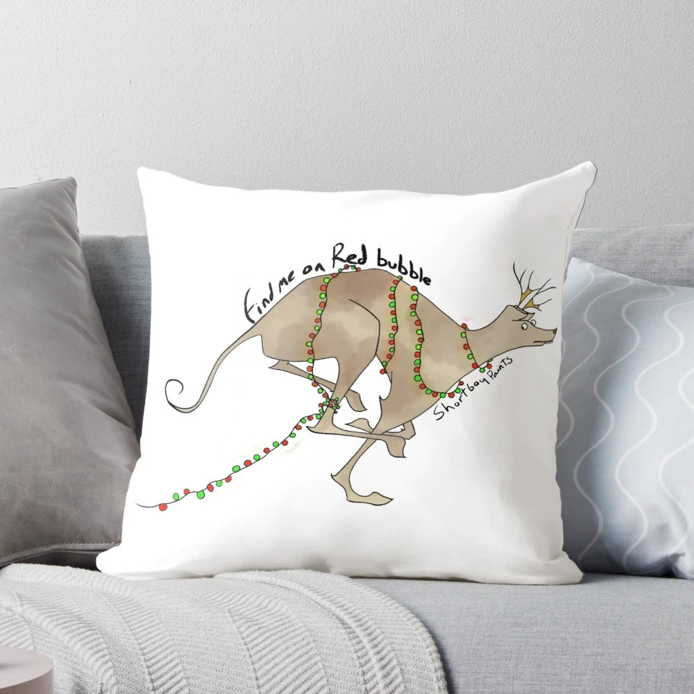 A festive pillow featuring a sneaky looking greyhound or sighthound dog breed, perfect for holiday home decor.